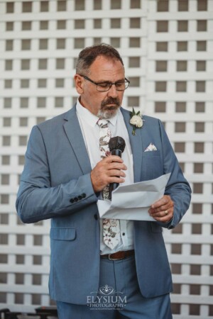 A wedding guest delivers his speech during the reception