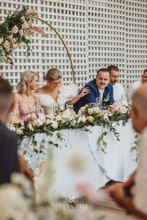 Newlyweds react to the funny wedding speech during their reception