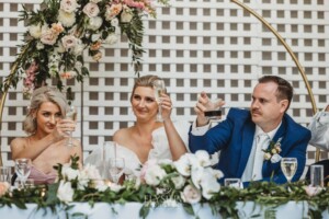 A bride and groom toast the wedding speech during the reception