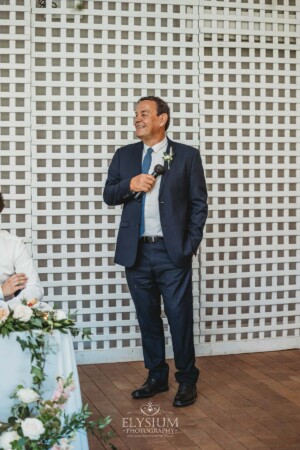 The grooms father makes his wedding speech during the reception