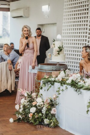 A bridesmaid makes her wedding speech during the reception