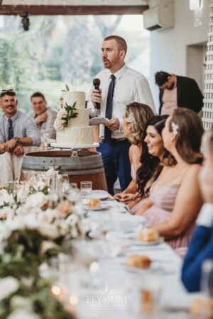 A groomsman makes his speech during the wedding reception