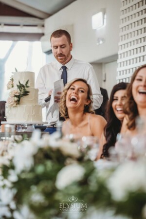 A groomsman makes his speech during the wedding reception