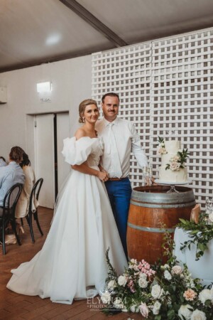 A bride and groom cut their wedding cake during the reception at Burnham Grove