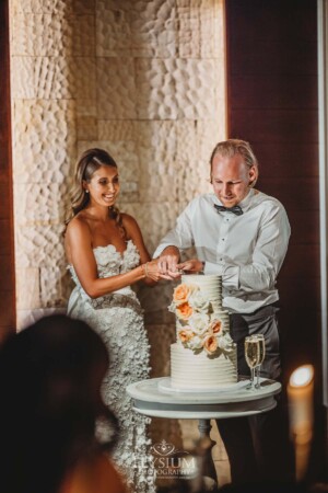 A couple cut their wedding cake during the reception at Zest in Sydney