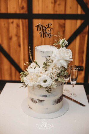 Wedding cake details adorned with flowers in the reception room