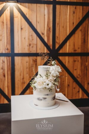 Wedding cake details adorned with flowers in the reception room