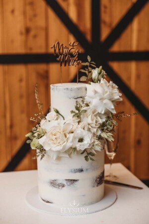 Wedding cake details adorned with flowers in the reception room