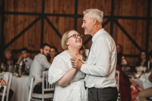 A bride shares her first dance with her father during the wedding reception at Ottimo House