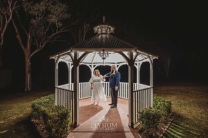 Night photos of a bride and groom under the gazebo at Ottimo House