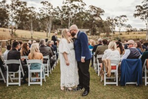 A bride and groom kiss after their wedding ceremony at Ottimo House in Denham Court