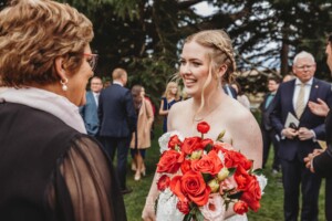 Wedding guests congratulate the happy couple after their ceremony at Bendooley