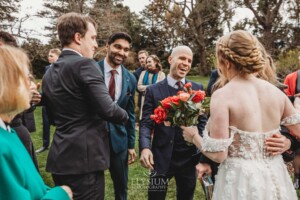 Wedding guests congratulate the happy couple after their ceremony at Bendooley