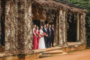 The bridal party pose for photos on the steps of the Bendooley Estate homestead after a wedding