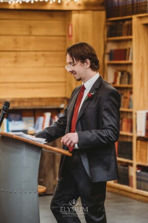The best man delivers his wedding speech during the reception at Bendooley Book Barn