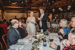 Candid photos of a bride and groom as they mingle with wedding guests during their evening reception