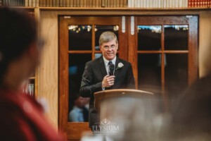 The father of the bride shares his wedding speech during the reception at Bendooley