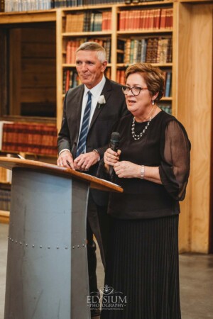 The groom's parents share their wedding speech during the reception at Bendooley