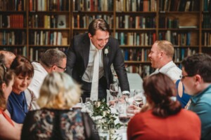 Candid photos of a bride and groom as they mingle with wedding guests during their evening reception