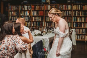 Candid photos of a bride and groom as they mingle with wedding guests during their evening reception