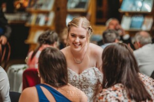 Candid photos of a bride and groom as they mingle with wedding guests during their evening reception