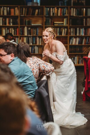 Candid photos of a bride and groom as they mingle with wedding guests during their evening reception