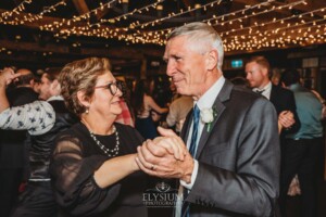 Wedding guests dancing during the reception at Bendooley Estate Book Barn