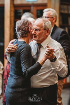 Wedding guests dancing during the reception at Bendooley Estate Book Barn