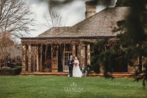 A bride walks across the lawn to greet her groom during their outdoor wedding ceremony