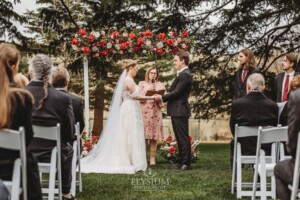 A couple share their wedding vows during the outdoor ceremony on the lawn at Bendooley Estate