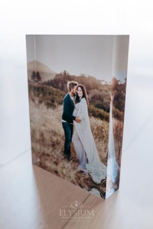 A maternity portrait displayed in an acrylic photo block