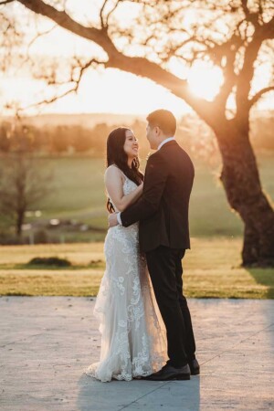 Newlyweds dance at sunset after their wedding ceremony at Burnham Grove Estate