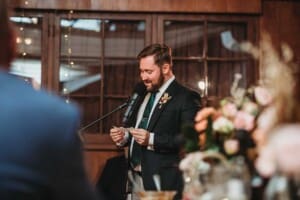 A groom makes his wedding speech during the reception at Gledswood