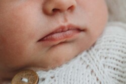 Details photo close up on a newborn baby's mouth