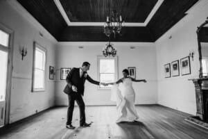 A bride and groom dance together in an old room at Gledswood estate