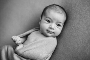 Baby laying on a soft blanket in the Ingleburn natural‑light studio, taken by a newborn photographer